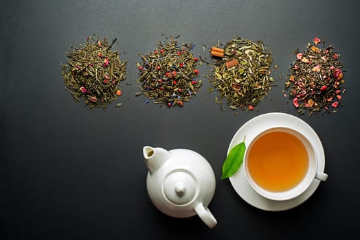 Cup of tea with dry tea collection of different types