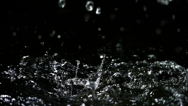 Water splash on black background color which represent clean and pure natural freshness of liquid for healthy drink or sparkling water