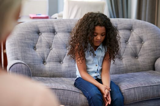 Young girl having therapy with a child psychologist