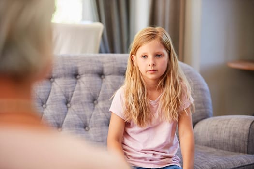 Young girl having therapy with a child psychologist