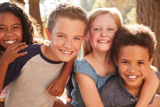 Portrait Of Children With Friends On Hiking Adventure In Woods