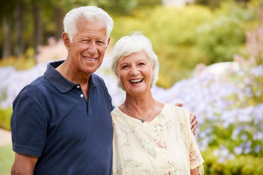 Portrait Of Senior Couple Enjoying Walk In Park Together