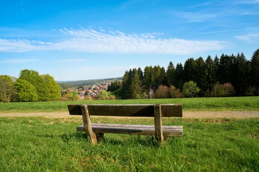 Bank on a hiking trail in the village of Braunlage in the Harz National Park