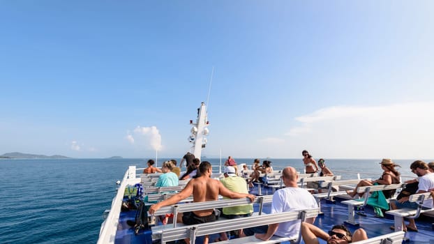 SURAT THANI, THAILAND-APRIL 28, Group of tourists on the deck are relax and enjoy the natural landscape of sea in summer during the travel by boat at Koh Samui island, APRIL 28, 2017 in Thailand