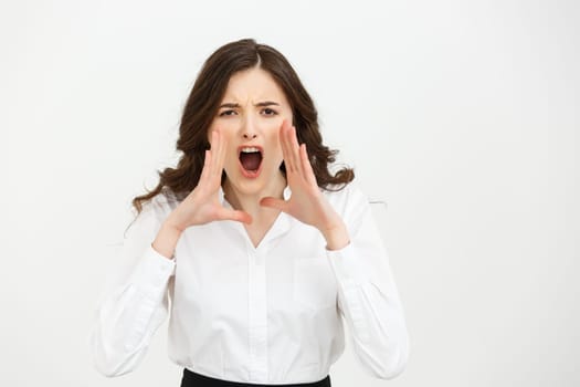 Business Concept: Closeup portrait of a businesswoman yelling isolated on white background.