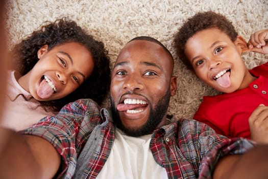 Point Of View Shot Of Father And Children Posing For Selfie