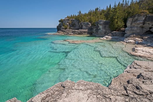 Colorful Waters on a Secluded Indian Cove on Lake Huron in Bruce Peninsula National Pqrk in Ontario