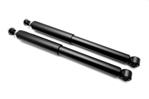 New shock absorbers on white background