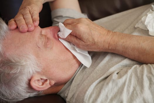 Older man has runny nose and headache