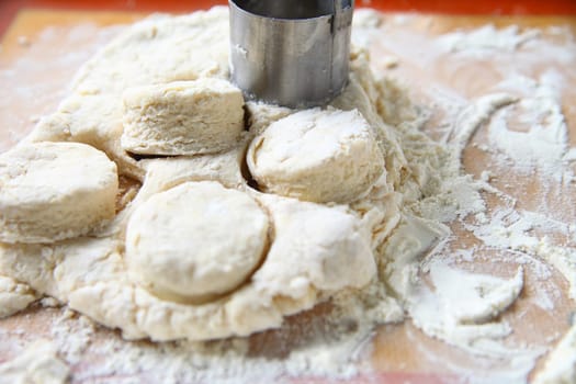 Cutting out Southern-style biscuits before baking