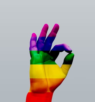Human hand OK sign. Colors of rainbow