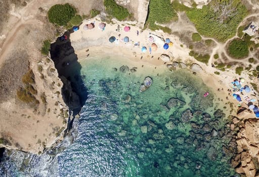 Aerial View of a beautyful Sandy Beach and Sea with turquoise water