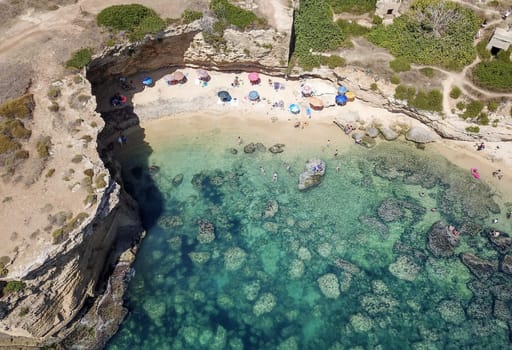 Aerial View of a beautyful Sandy Beach and Sea with turquoise water