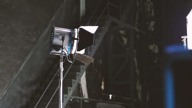 Big studio lighting kit 5000 watt with soft box on tripod and professional green screen background chroma key post production technique shooting or filming for movie or video commercial set up.