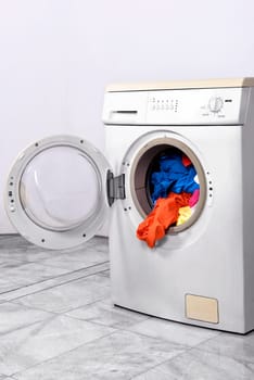 Clothes inside washing machine. Home appliances