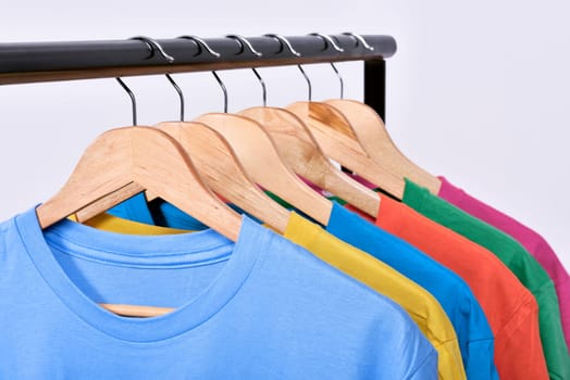 Clothes hang on a shelf after washing isolated over white background