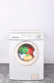Dirty clothes washed on washing machine. Home appliances