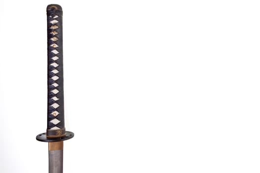 Detail from the very sharp steel blade on a Japanese Samurai sword or Katana.  The blade has to be constantly kept waxed to protect against oxidization and to retain sharpness.