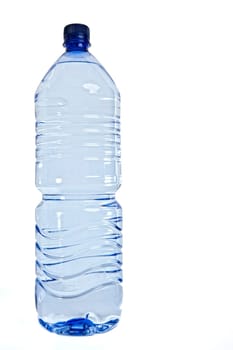 A bottle of still mineral water over a white backdrop