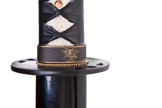 Japanese katana or samurai sword over a white background