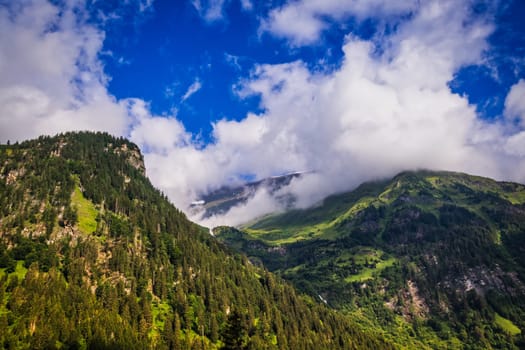 Hohe Tauern mountain landscape,Alps in Austria with source clouds
