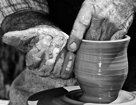A potter's hands creating a new work of art