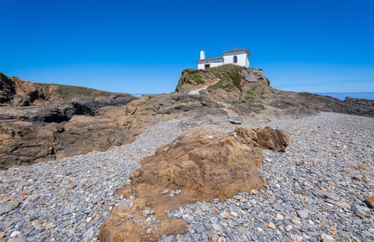 The hermitage of the Virgen del Puerto in Meirás, A Coruna, Galicia, Spain.Landscape of the coast of Galicia, lighthouse.