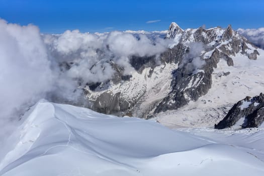 Mont Blanc mountain, view from Aiguille du Midi. France. In background Grands Jorasses mountain.