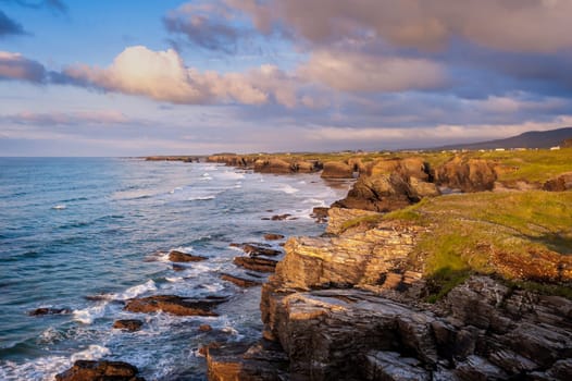 Landscape of sea, cliff blue sky with clouds. Ocean coast in the north west of Spain, Galicia region. Touristic travel.