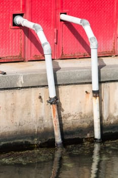 Drainage pipes that come out from metal caisson