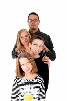 A family standing isolated on white background, dad, mother, daughter.and son, standing behind each other..