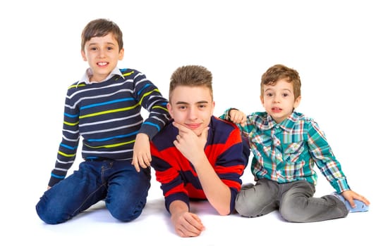Shot studio with three brothers on white background