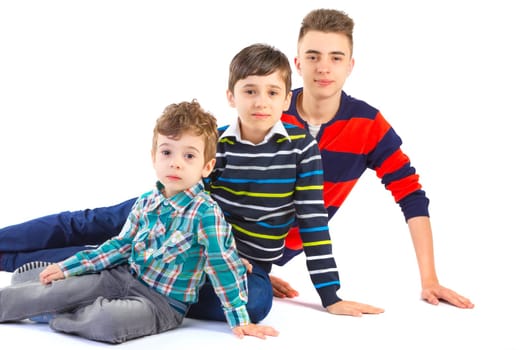 Shot studio with three brothers on white background