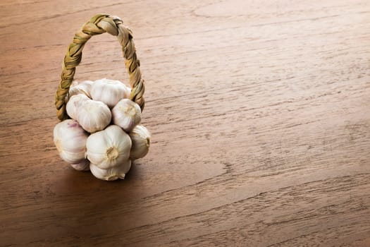Organic garlic on wood table