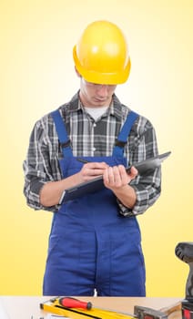 a young worker with a tablet in his office