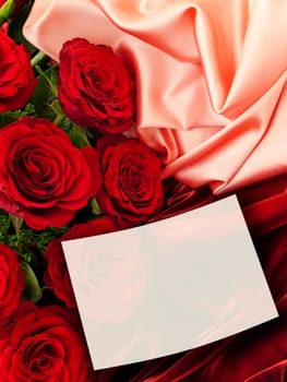 Red Roses With White Greeting Card At Fabric