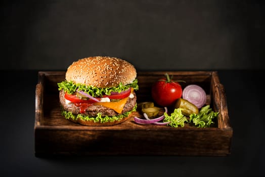 Homemade hamburger or burger with fresh vegetables and cheese