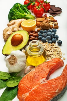 Selection of healthy food on white background. Healthy diet foods for heart cholesterol and diabetes.