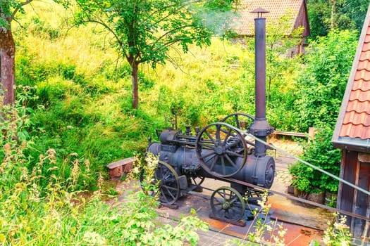 A steam engine traction engine driving a threshing machine