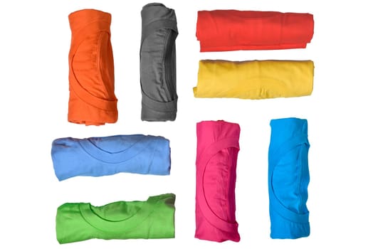Set of colorful rolled clothes isolated over white background