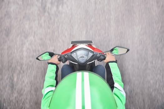 Top view of motorcycle taxi driver on the street