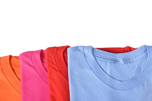 Row of colorful shirts isolated over white background
