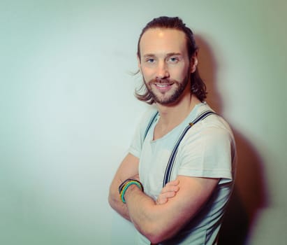 young bearded man lokking friendly in to the camera