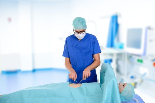 young surgeon with patient in front of clinic- background
