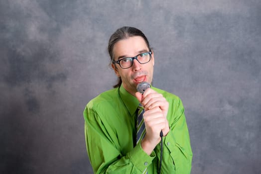 young crooner in green shirt and necktie