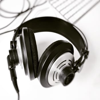 black and white stereo headphones. selective focus. Music and relaxation concept