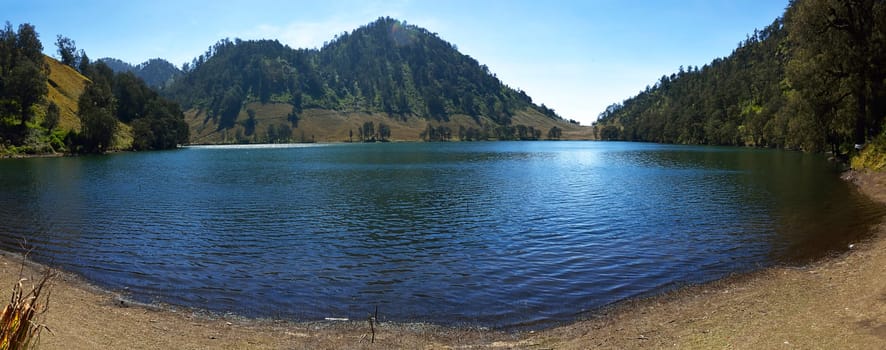 Panorama of Ranu Kumbolo Lake in Semeru Mountain. Malang, Indonesia