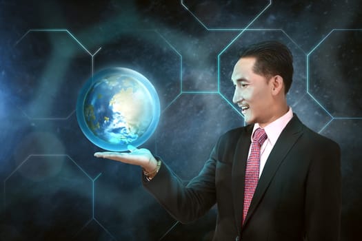 Asian businessman holding earth planet on his hand with outer space background