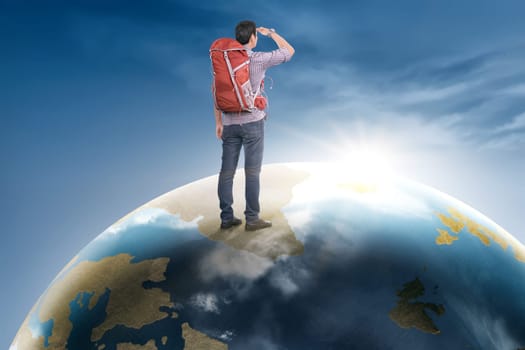 Rear view asian traveler man with backpack standing on earth planet looking at sunrise
