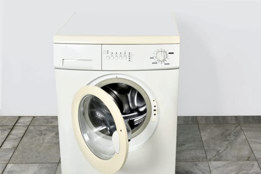Washing machine with open door in home